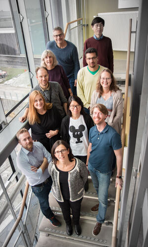 a group of people looking up at the camera